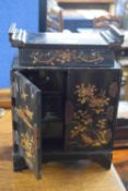 A late 19th or early 20th Century Oriental black lacquered table top cabinet with six small drawers