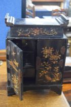 A late 19th or early 20th Century Oriental black lacquered table top cabinet with six small drawers