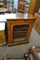 Victorian walnut veneered and floral inlaid pier cabinet with single arched glazed door opening to a