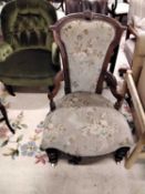 A Victorian floral upholstered nursing chair