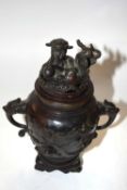 A pair of Chinese or Japanese bronze censers, both with dragon finials, 23cm high