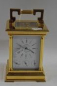 L'Epee, a good quality contemporary French brass cased carriage clock with white enamel dial with