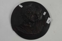 A Spelter plaque of a gentleman in circular metal base, 25cm diameter