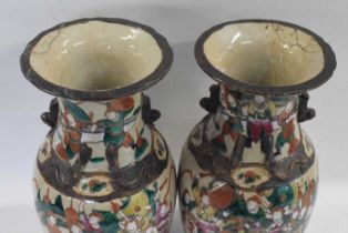 A pair of Chinese crackle ware vases, late 19th Century with designs of Chinese figures in famille