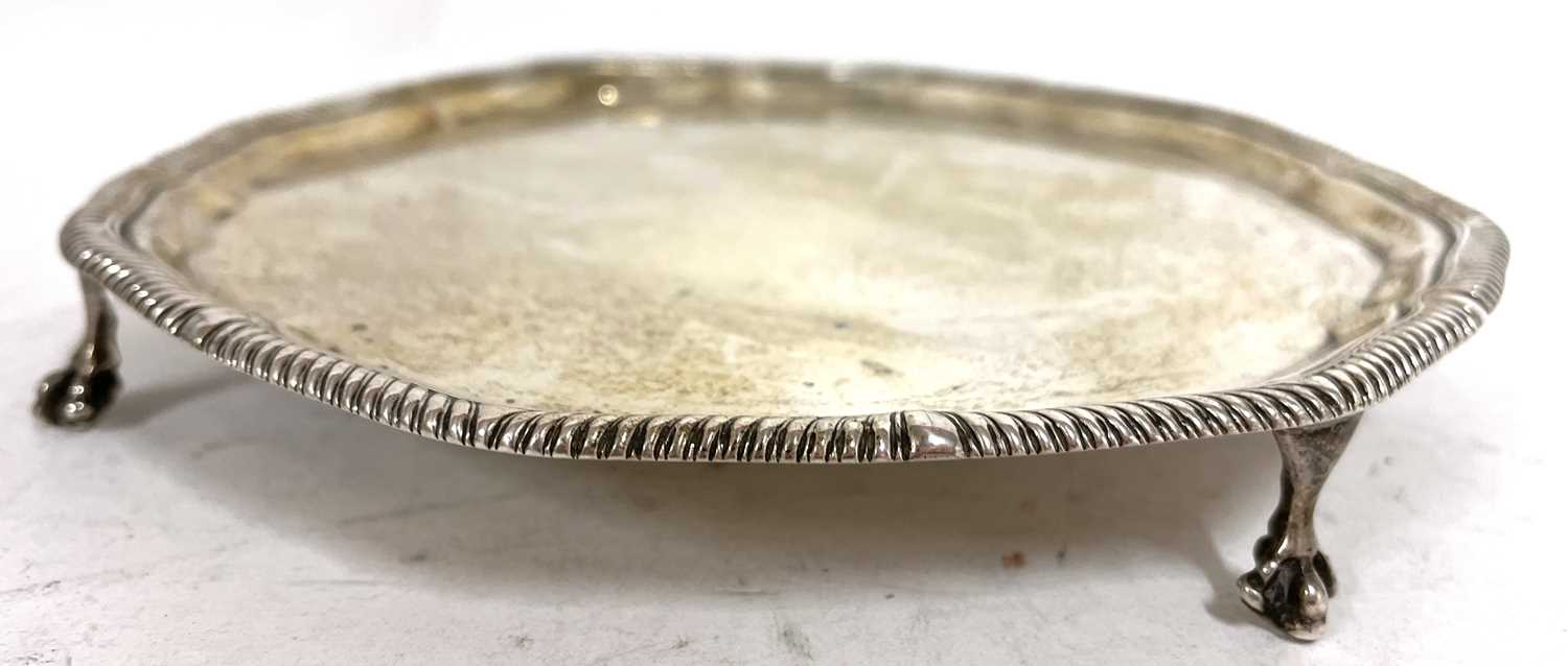 George V silver salver, the scalloped rim with gadrooned border supported on four claw and ball - Image 3 of 5