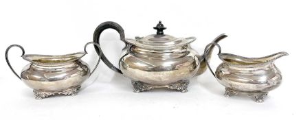 George V silver three piece tea set comprising teapot, sugar bowl and cream jug of oval form, each