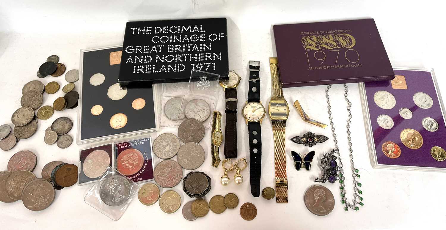 A mixed lot of wristwatches along with some coinage, makers of the watches include Timex, Montire