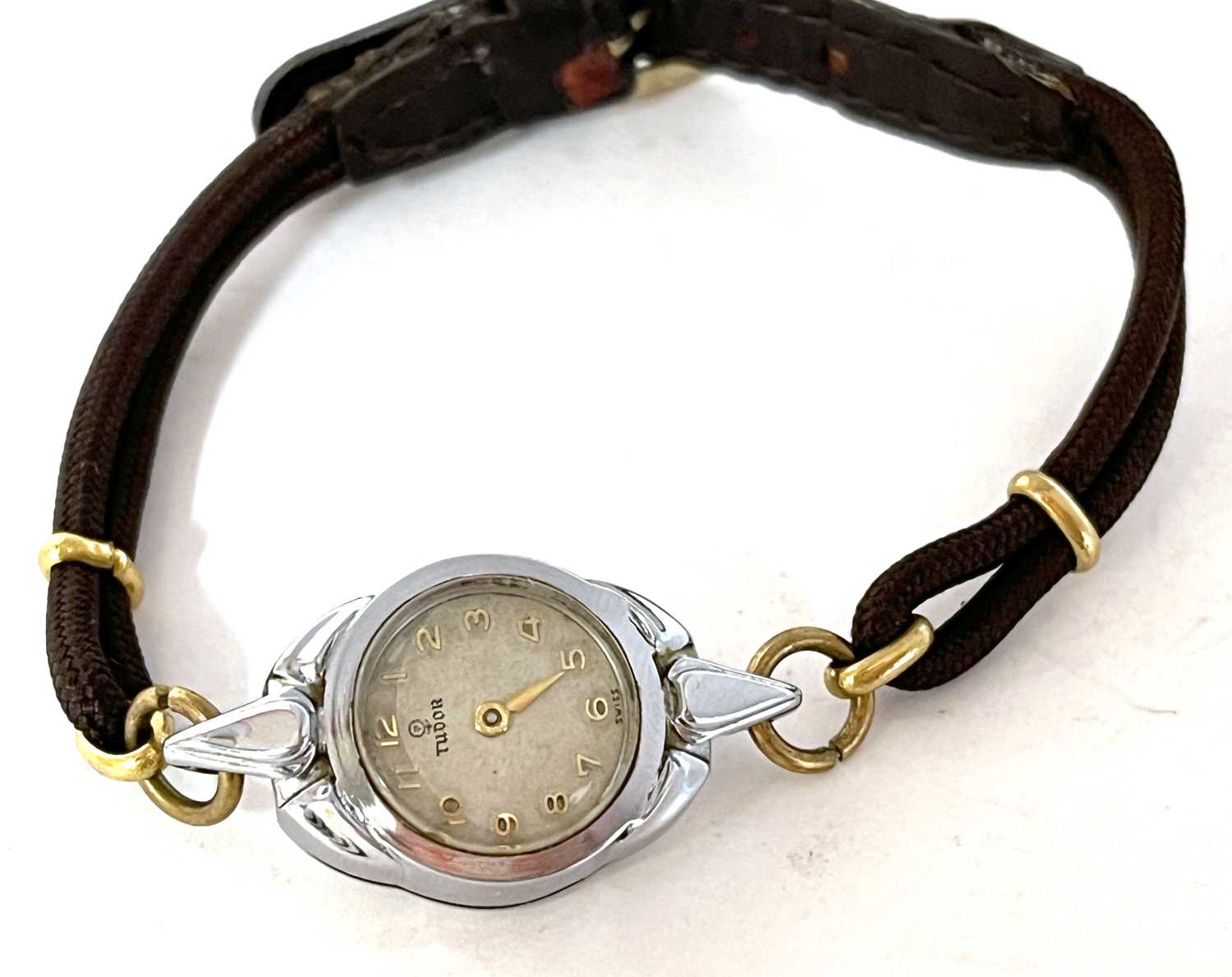 A ladies Tudor wristwatch, the watch has a cream dial along with gold coloured Arabic numeral hour