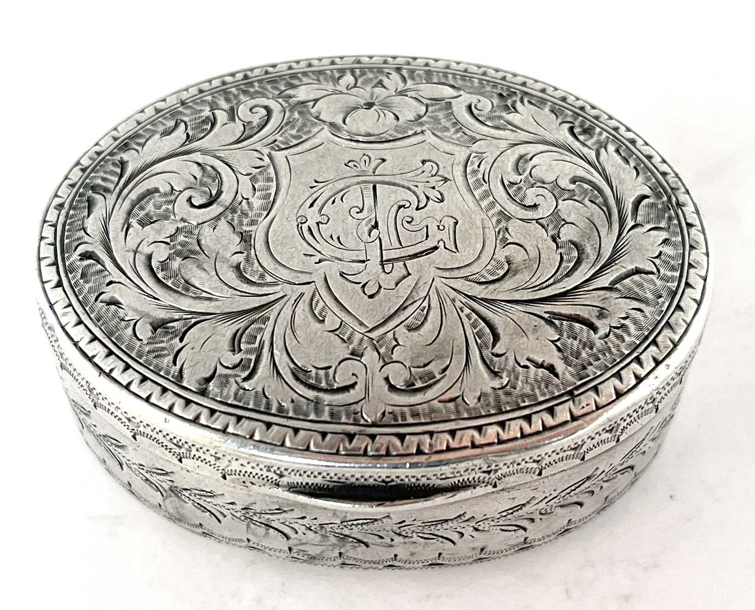 Edwardian silver snuff box of oval form, the hinged lid chased and engraved all over with scrolls - Image 2 of 7