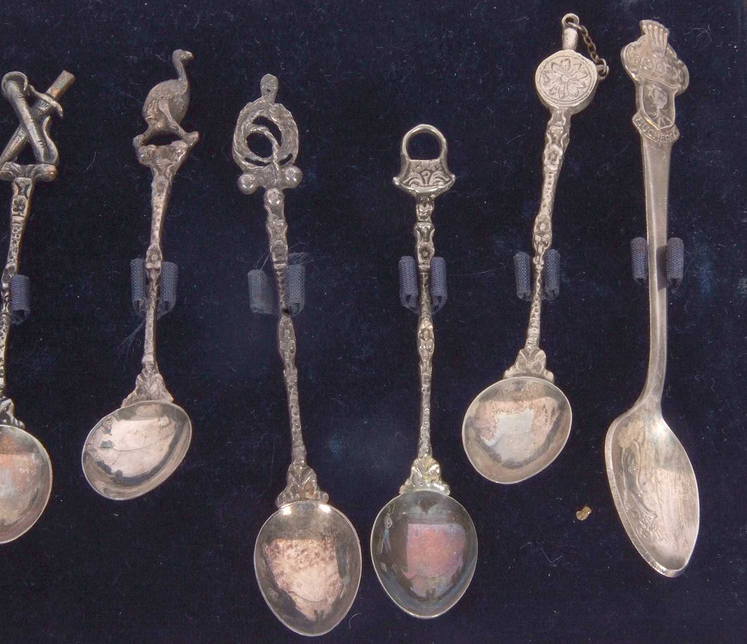 A cased set of eleven (of twelve) Spanish silver decorative coffee spoons with cast stems and - Image 5 of 5