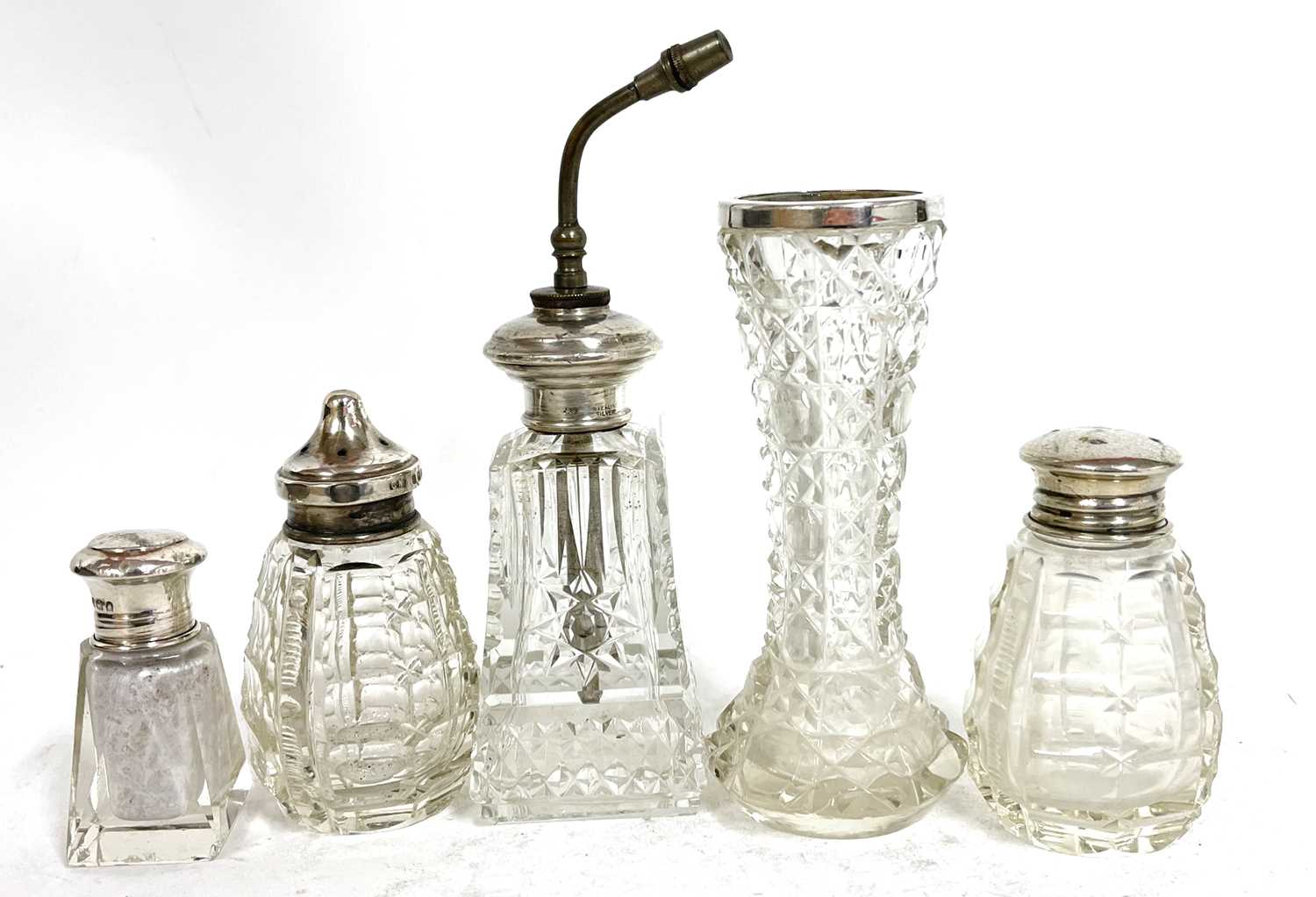 Group of five small glass bottles and a vase each with a silver/sterling mount, various dates and