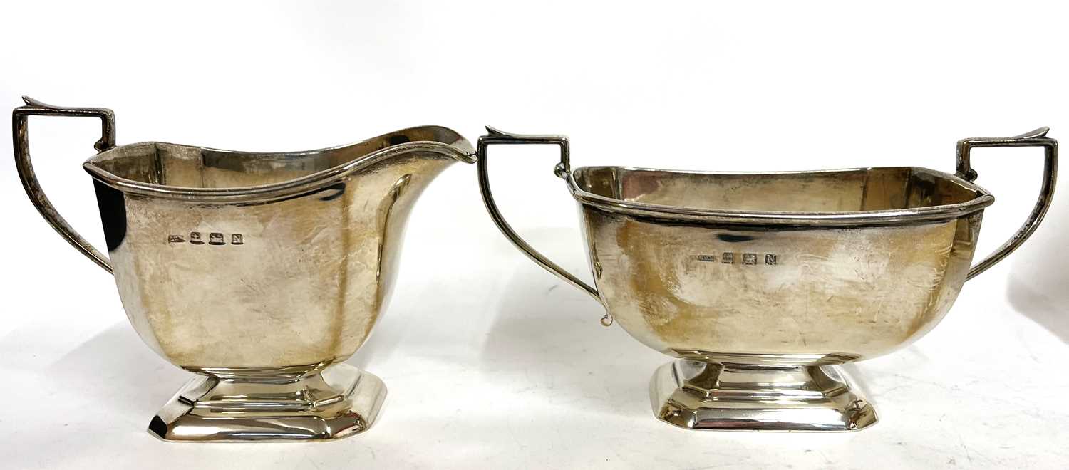 Art Deco silver three piece tea set of plain panelled form comprising teapot, sugar bowl and cream - Image 6 of 9