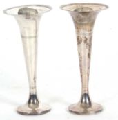 Pair of George V trumpet flower vases on circular reeded loaded bases, reeded rim, 18cm tall,