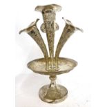 Chinese white metal four trumpet table epergne, chased and embossed with flowers and foliage, having
