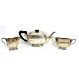 Art Deco silver three piece tea set of plain panelled form comprising teapot, sugar bowl and cream