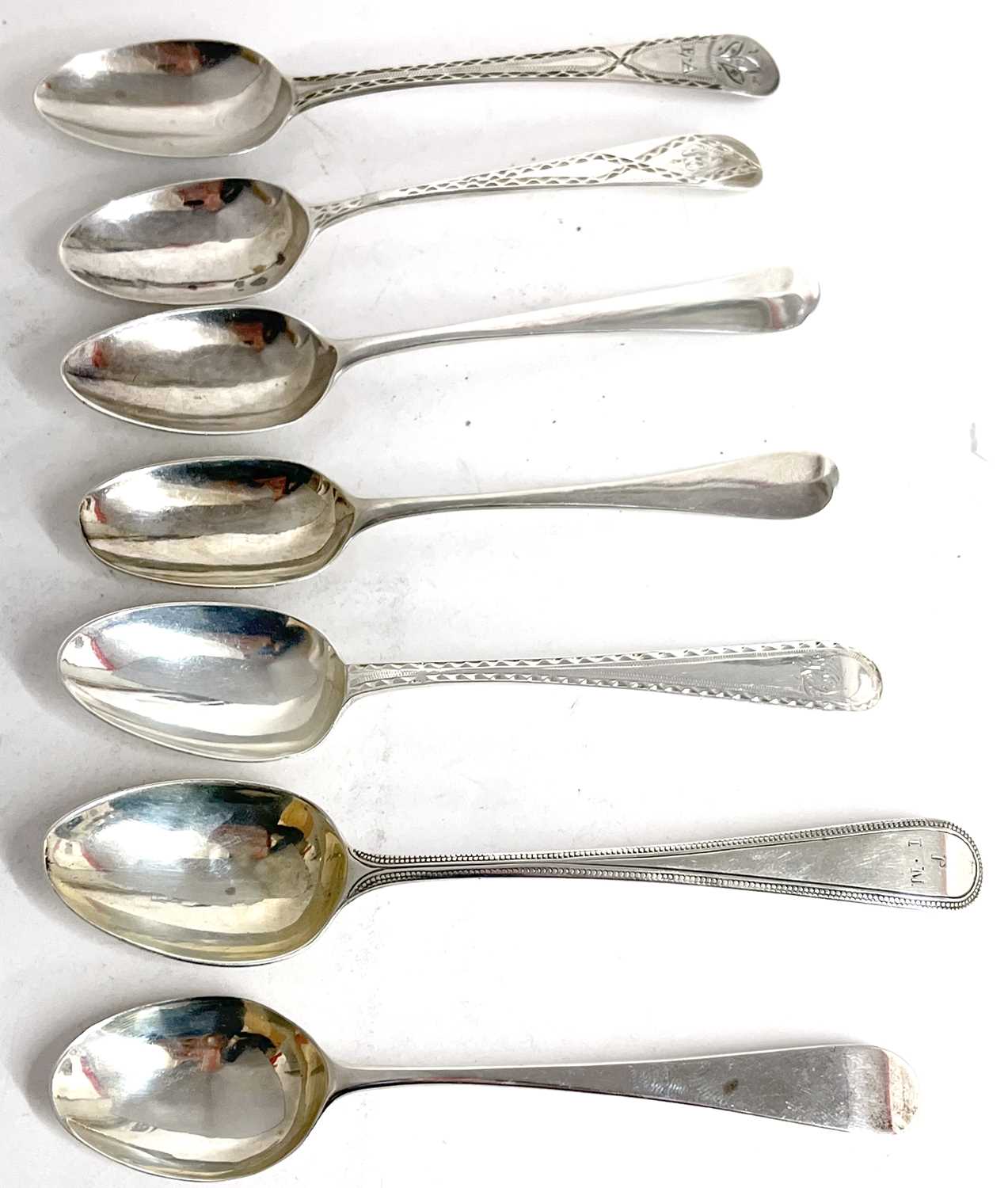 A group of seven Georgian teaspoons, five base marked and two others (7)
