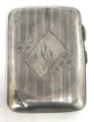 Edwardian silver cigarette case of typical form, chased and engraved around a cartouche,