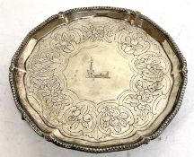 George III silver armorial footed small salver engraved with heraldic device of an arm holding a