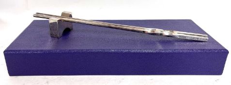 Shanghai Tang boxed pair of white metal chopsticks with a rest presented in a designer box