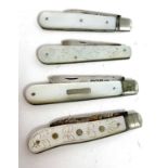 Group of four silver bladed and mother of pearl handled folding fruit knives to include two plain