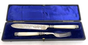 Cased pair of mother of pearl handle cake servers with plated blades, silver ferrules and caps