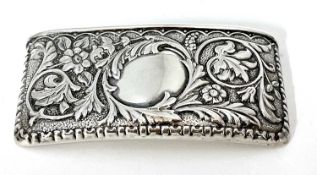 Edwardian silver card case of slight curved rectangular form, embossed with foliate and scrolls