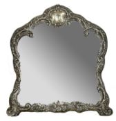 Victorian silver arch shaped framed easel backed dressing table mirror, the frame with scrolling