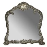 Victorian silver arch shaped framed easel backed dressing table mirror, the frame with scrolling