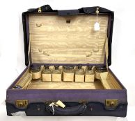 Vintage purple leather dressing case, part fitted with eight glass jars each with silver and