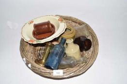Basket containing various vintage bottles, jars and other items
