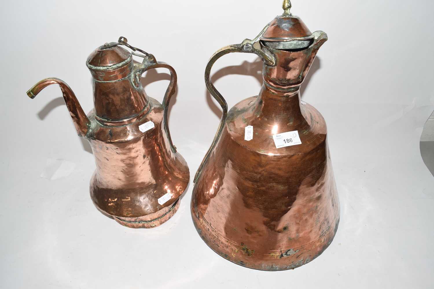 Two Middle Eastern copper jugs or kettles