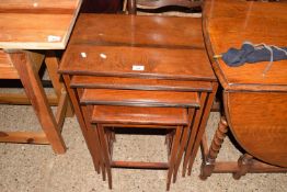 Edwardian mahogany nest of four tables on tapering legs
