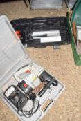 Powerbase cordless drill together with a boxed Surveyors theodolite