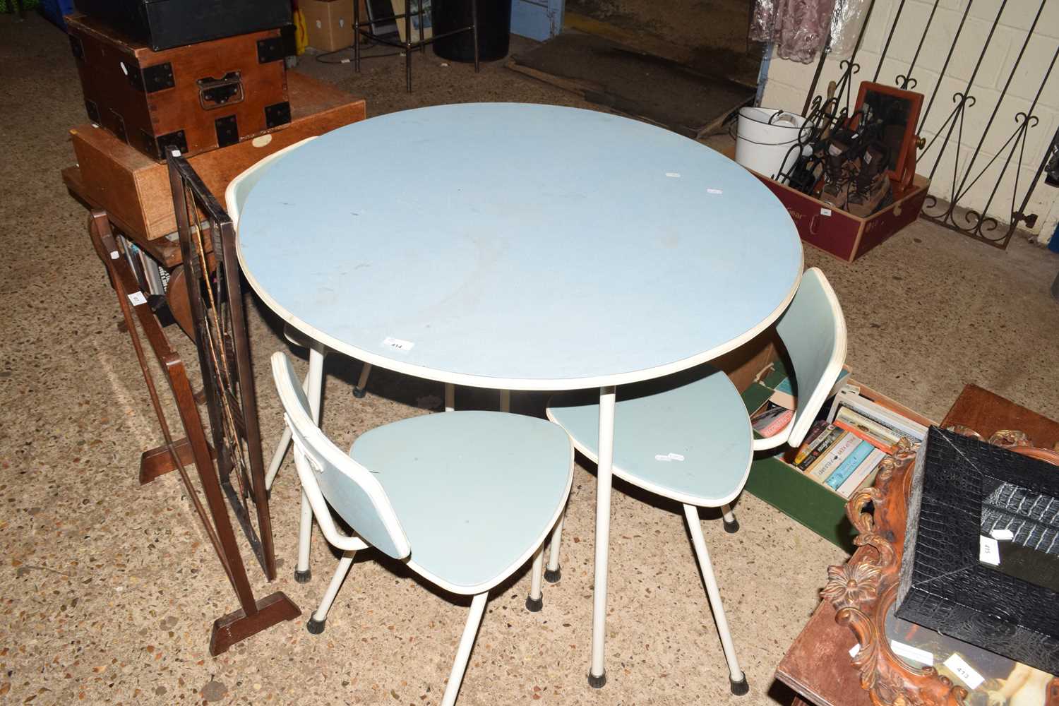 Circular blue melamine topped retro table and four accompanying chairs