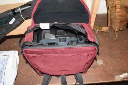 Canon T70 camera with travel case and various accessories