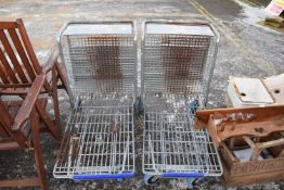 Pair of metal luggage trolleys
