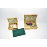Two polished green onyx boxes containing various assorted costume jewellery
