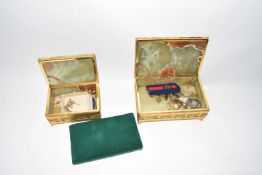 Two polished green onyx boxes containing various assorted costume jewellery