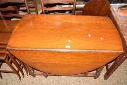 Early 20th Century oak drop leaf dining table on barley twist legs