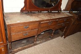 19th Century oak five drawer dresser base on turned supports with base shelf (requiring