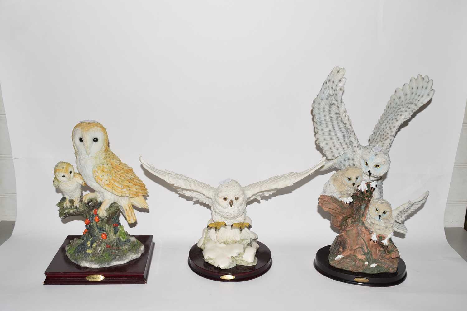 Group of three resin model owls