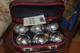 Case of Petanque balls together with a metal cash tin (2)