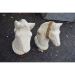 Pair of concrete horses heads