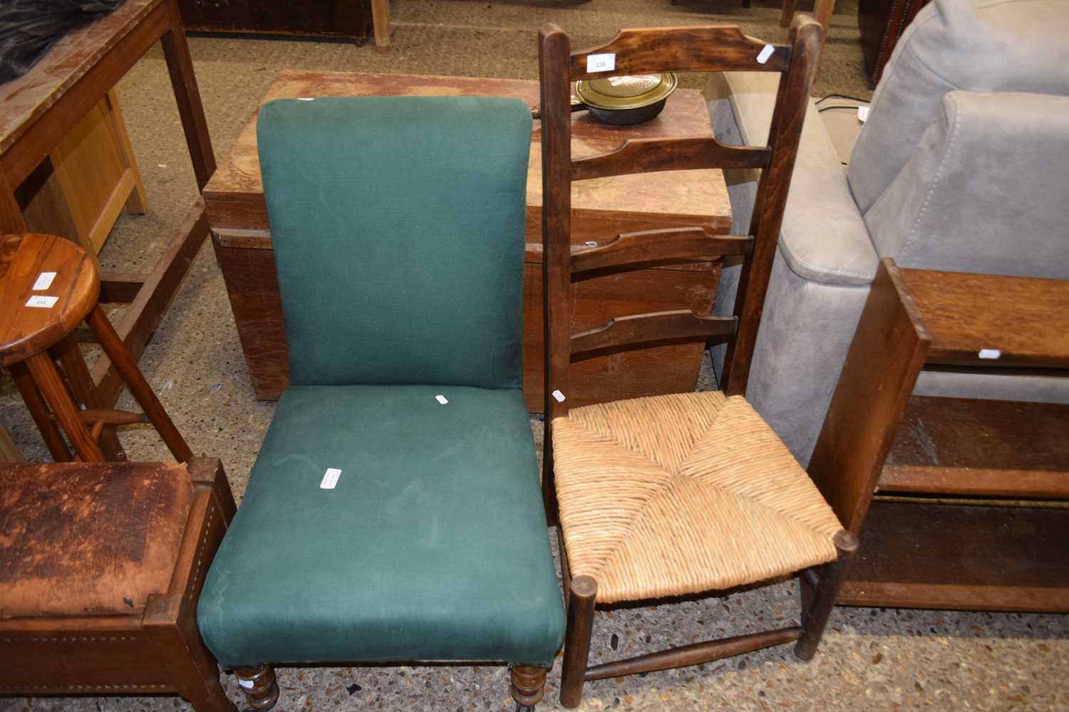 Ladder back rush seated chair together with a green upholstered nursing chair (2)