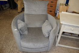 Grey upholstered circular revolving armchair