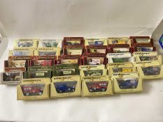 Box of various Matchbox and other toy vans in original packaging