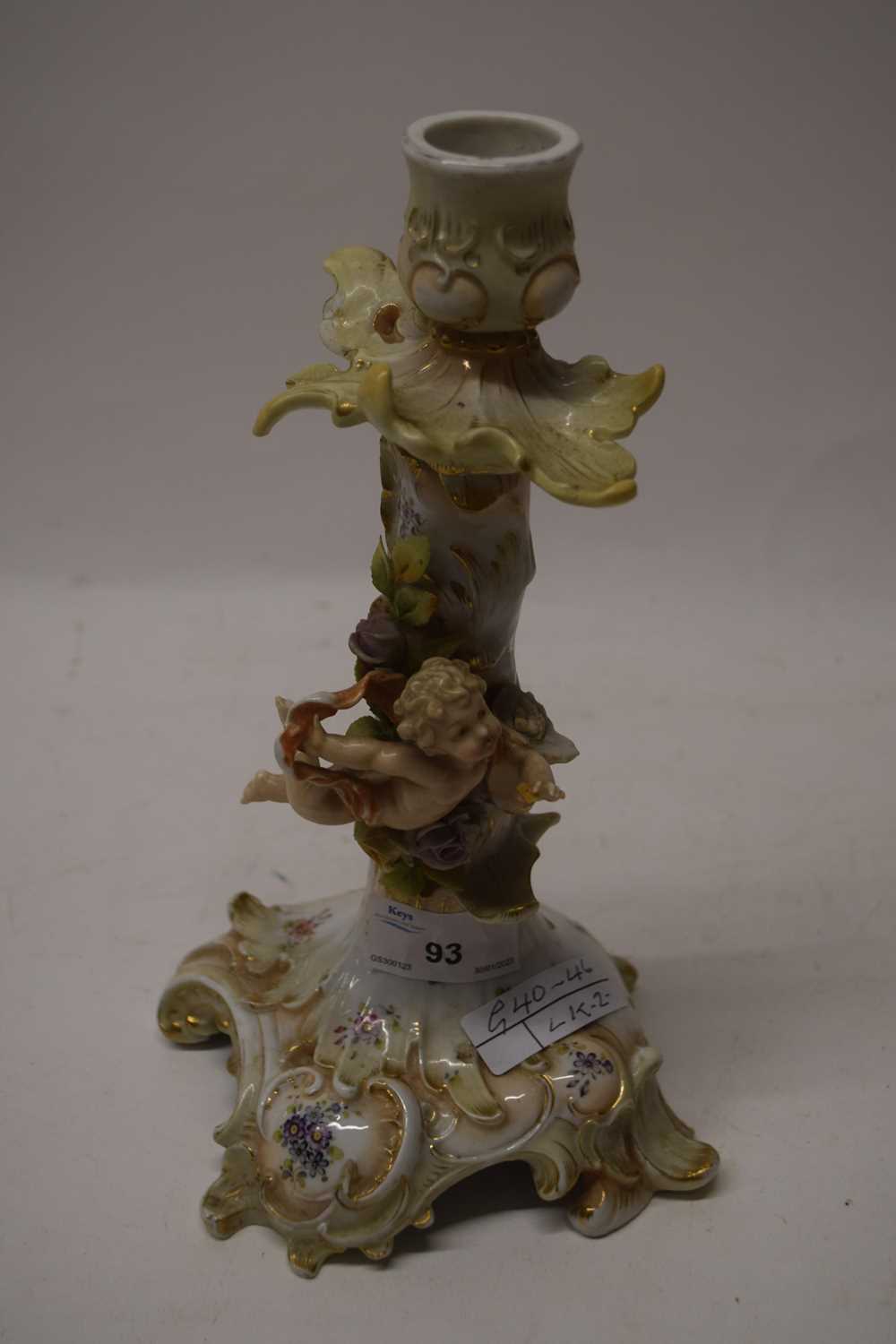 Continental porcelain candlestick with cherub decoration