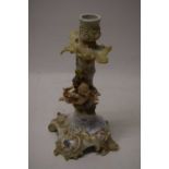 Continental porcelain candlestick with cherub decoration