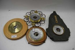 Group of four modern barometers