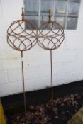 Pair of iron spherical garden ornaments